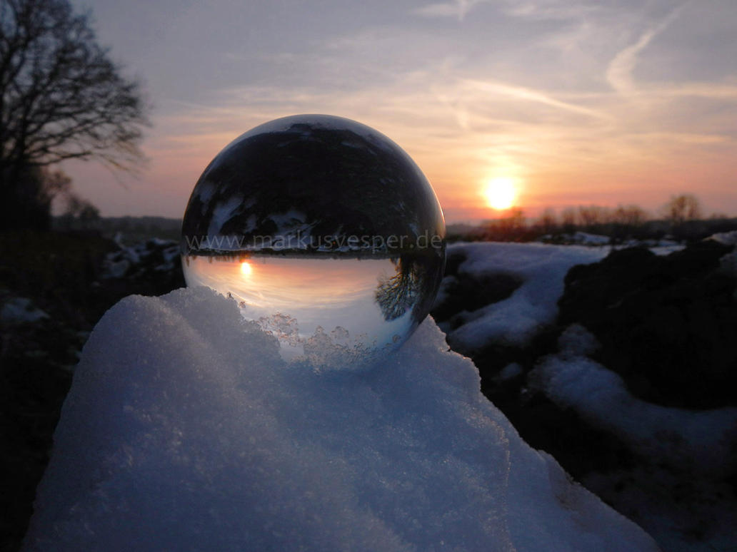 crystaline_sphere_on_snow_pile_at_sunset_by_acrylicdreams-daxb7j3.jpg